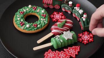 Natural popsicle ice cream on a stick covered with chocolate in the style and colors of Christmas and New Year on a dark concrete background video