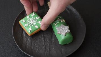 Natural popsicle ice cream on a stick covered with chocolate in the style and colors of Christmas and New Year on a dark concrete background video