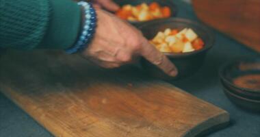 A person is holding a wooden bowl with food in it video