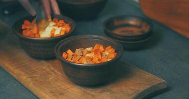 A person is stirring some food in a bowl video