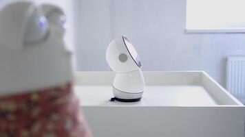 Robot smoothly rotating its head from right to left in slow motion video