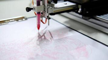 Robotic arm drawing complex pattern with red ink in slow motion. Minsk, Belarus - May 25, 2022 video