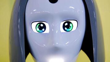 Close-up slow motion of robot face displaying animated eyes video