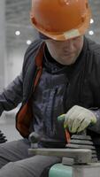 A worker skillfully operating machinery in an industrial setting, ensuring safety and efficiency. Clip video