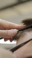 A Professional Barber Skillfully Cutting Hair Using HighPrecision Tools and Techniques. Clip video