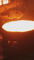 Witness the intense and mesmerizing molten metal pouring process occurring in a foundry setting. Stock Clip video
