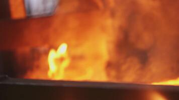 An engineer stoker loads a flaming furnace with coal. Stock Clip video