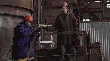 Workers are actively collaborating with each other in a dynamic industrial environment today. Stock Clip video