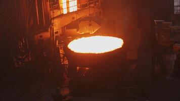 Witness the intense and mesmerizing molten metal pouring process occurring in a foundry setting. Stock Clip video