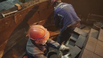Workers Engaged in the Repair of an Industrial Structure While Utilizing Essential Safety Gear. Stock Clip video