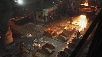 The operation of an industrial foundry involves the casting of molten metal for manufacturing needs. Stock Clip video