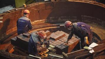 Workers Involved in the Process of Constructing a Circular Architectural Structure. Stock Clip video