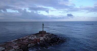 Lighthouse of the dam in the middle of the sea video