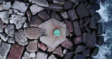 Stones on the dike in the middle of the sea with the waves video
