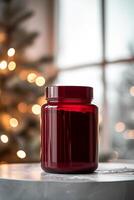 A red jar sitting on a table photo