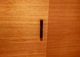 Minimalist Design Wooden Surface with Metal Handle Interior Decor Inspiration photo