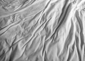 Crumpled White Sheet Texture for Minimalist Design and Background Use photo