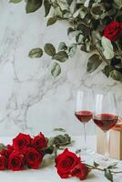 Romantic setting featuring a glass of red wine, fresh roses, and chocolate in a cozy arrangement perfect for a photo