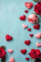Romantic arrangement of roses and heart decorations on a blue textured background creates a vibrant and photo