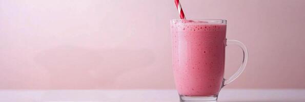 Delicious pink smoothie topped with fresh raspberries served in a clear glass mug against a pastel background photo