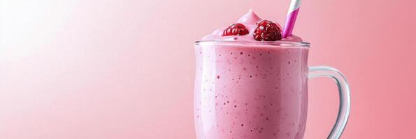 Delicious pink smoothie topped with fresh raspberries served in a clear glass mug against a pastel background photo
