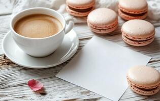 Coffee cup rests next to macaroons and scattered coffee beans on a cozy knit blanket during a leisurely photo