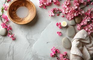 Relaxing spa setting with natural elements showcasing calm ambiance, soft towels, flowers, stones, and soothing photo