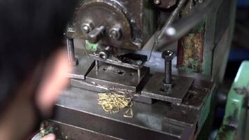 Machine and tool of Computer numerical control CNC, factory creates metal religion art such as Gold rolling machine and little jewelry in religious ceremony. video