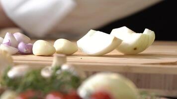 Cut mixed Onion, red Onion and Galic into small pieces and slice with a kitchen knife by professional chef. video