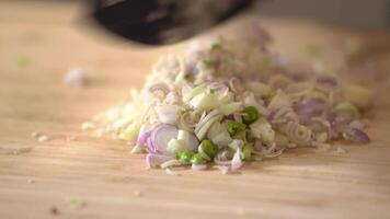 Cut together between Lemon Grass Onion, red Onion, Galic, and Chilli into small pieces and slice with a kitchen knife by professional chef. video