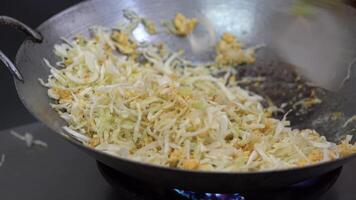 Stir fried Cabbage is cooked in the pan on gas stove video