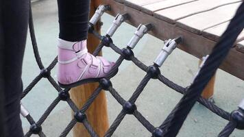 Child climbing playground rope net video