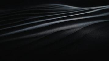 Soft contours of dark sand create elegant forms against subtle lighting photo