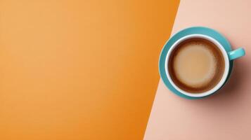 Enjoying a warm cup of coffee on a vibrant orange background photo