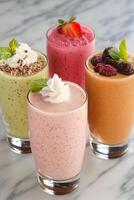 Colorful array of smoothies with fresh fruit in a bright setting photo