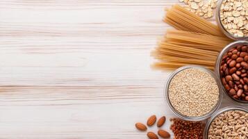 Colorful arrangement of jars filled with various grains, legumes, and pasta on a shelf photo
