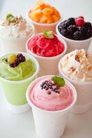 Colorful array of smoothies with fresh fruit in a bright setting photo
