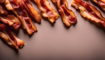 Crispy Bacon Strips on a Brown Background photo