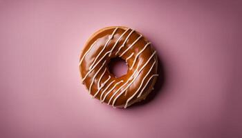 Chocolate Donut with White Icing on Pink Background photo
