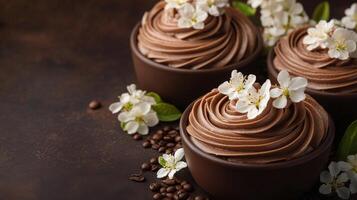 Beautifully decorated chocolate cupcakes arranged on a pink surface during daylight photo