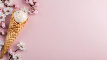 Delicious three scoop strawberry ice cream cones held in hands against a blue background photo