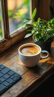 Coffee cup on wooden table near keyboard and plant in cozy workspace photo