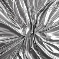 Foil texture. Aluminium paper sheet. Crumpled metallic surface background. Chrome rough industrial sheet photo