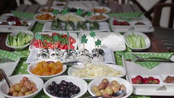 Festive table beautifully arranged with fruits and treats selection video