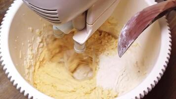 Transforming simple ingredients into a fluffy batter in slow motion video