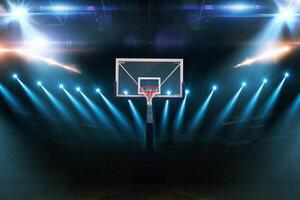 Basketball Championship. Modern Basketball Arena with Rings with Spotlights, Creative Idea. Tournament and Win. Basketball game with full hall of fans on dark background photo