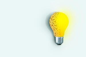 Creative brain light bulb shining on bright blue background, concept. Think differently, creative idea. Brainstorm. Creative thinking photo