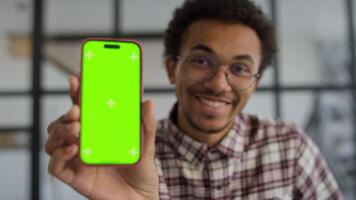 Smiling Man Showing Smartphone with Green Screen video