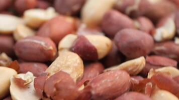 A CloseUp Visual of a Variety of Mixed Raw Peanuts in Different Colors video