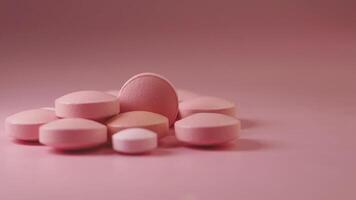 Dropping A Vibrant and Colorful Array of Pink Tablets on Pink Background video